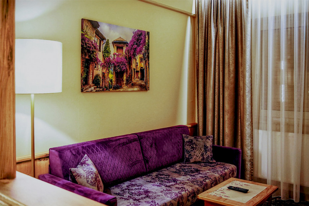 The cozy living area in the «Provence Country House« room